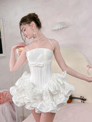 Women's mini dress with flare skirt, corset detailing, and strappy design.