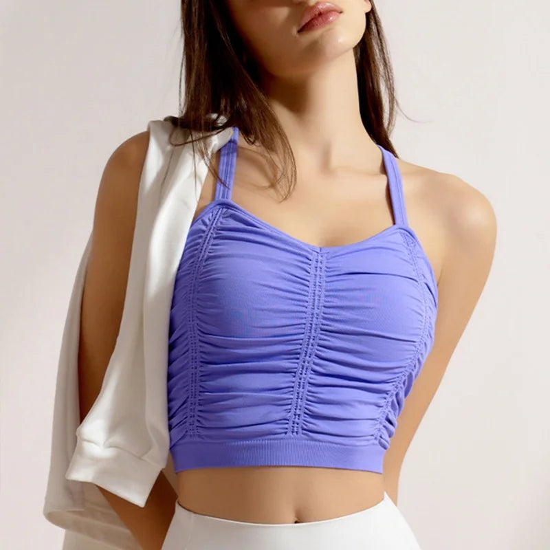 Woman wearing a purple ruched crop top 