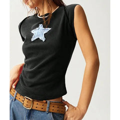 Model displaying a short round neck tank top with star appliques in a patchwork pattern.