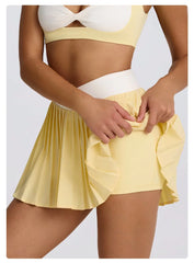 Person wearing a yellow skirt and white top  side view