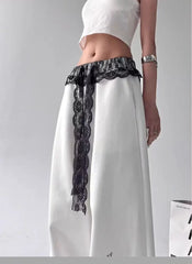 White pants with black lace detailing 