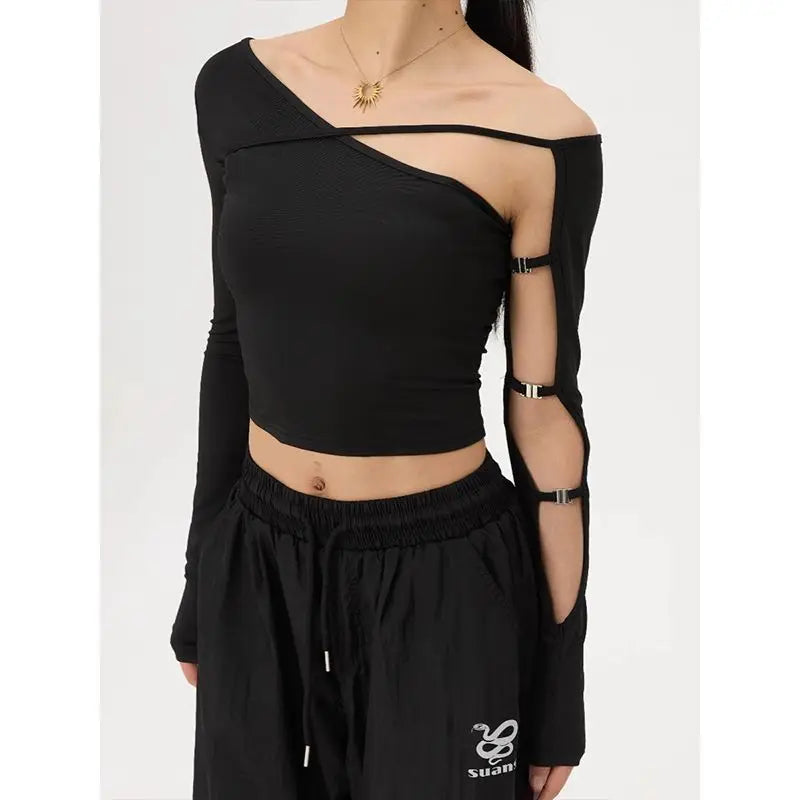 Black off-shoulder top with cut-out sleeves worn by a person 