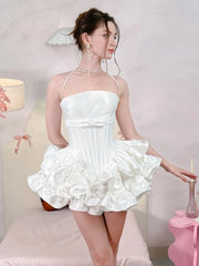 Women's mini dress with flare skirt, corset detailing, and strappy design.