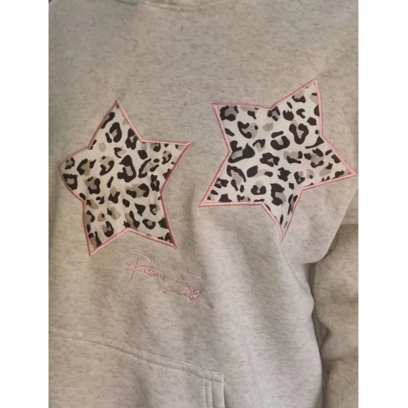 Women's star leopard print hoodie with a loose fit.

