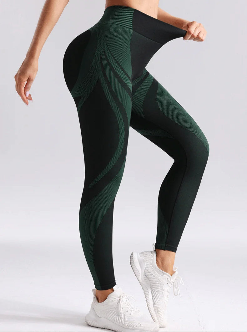 Green and black patterned leggings worn by a person- elastic details