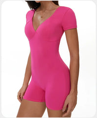 Pink bodysuit worn by a model side view