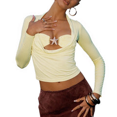 Woman wearing a light yellow long-sleeve top with a starfish design 