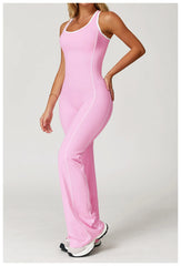 Person wearing a pink jumpsuit on a white background