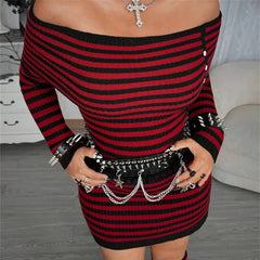 Woman wearing a red and black striped off-shoulder long-sleeve mini dress accessorized with a studded belt and cross necklace.