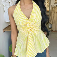 Yellow gingham halter top with a deep V-neck and a knotted twist front detail, showing a peplum hem.