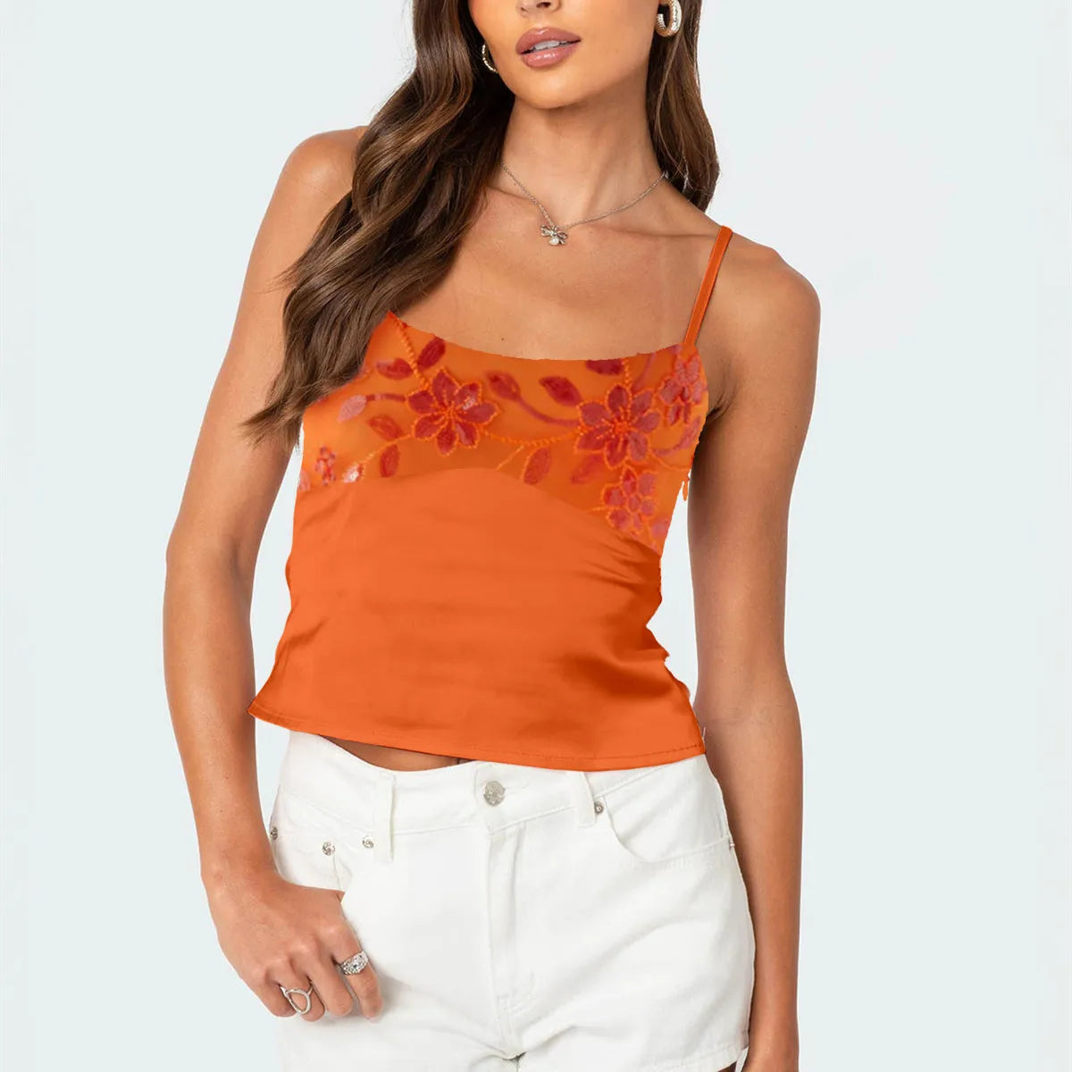 Woman wearing an orange floral tank top 