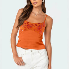 Woman wearing an orange floral tank top 