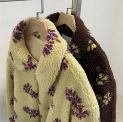 Two floral-patterned scarves on hangers 
