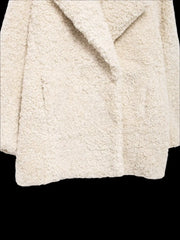 Women's white faux fur coat with a turn-down collar.