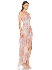 Woman wearing a pink floral dress on a white background