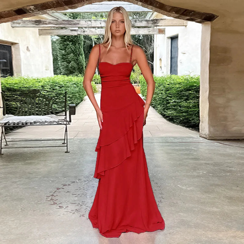 A red ruffled ankle-length maxi dress with a strappy lace-up back and a flattering square neckline.