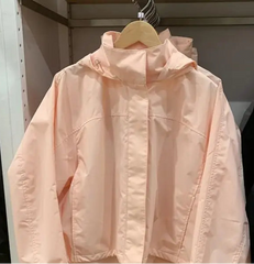 Pink jacket hanging on a rack 