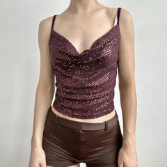 Mannequin wearing a sparkly burgundy top and matching shorts 