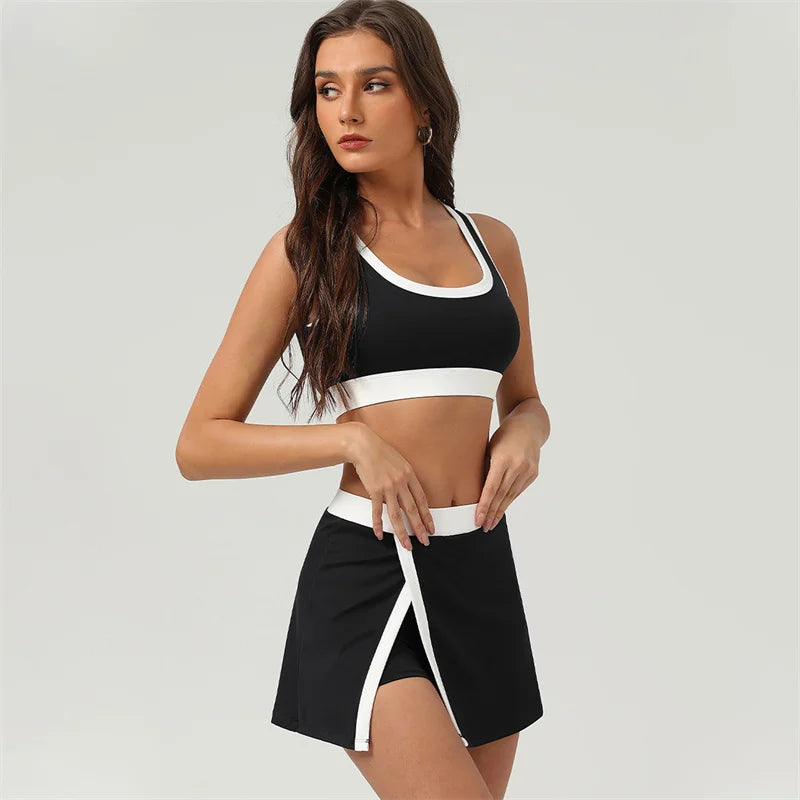 Woman wearing a black and white sports bra and skirt set 