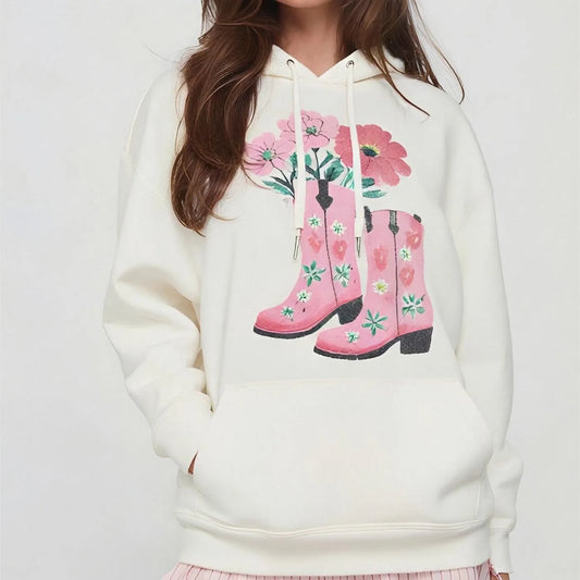 White hoodie with pink rain boots and floral design 