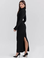 A woman wearing a flattering black maxi dress with a mock neck and a flowing silhouette, ideal for a special occasion.