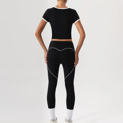 Person wearing a black athletic outfit - back view