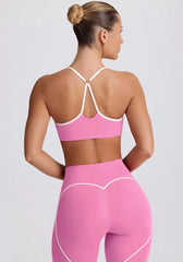 Person wearing a pink sports bra and leggings set - back view
