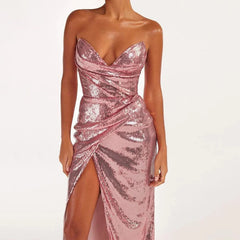 Pink sequin strapless wrap slit midi dress with asymmetrical design and sequin decoration.
