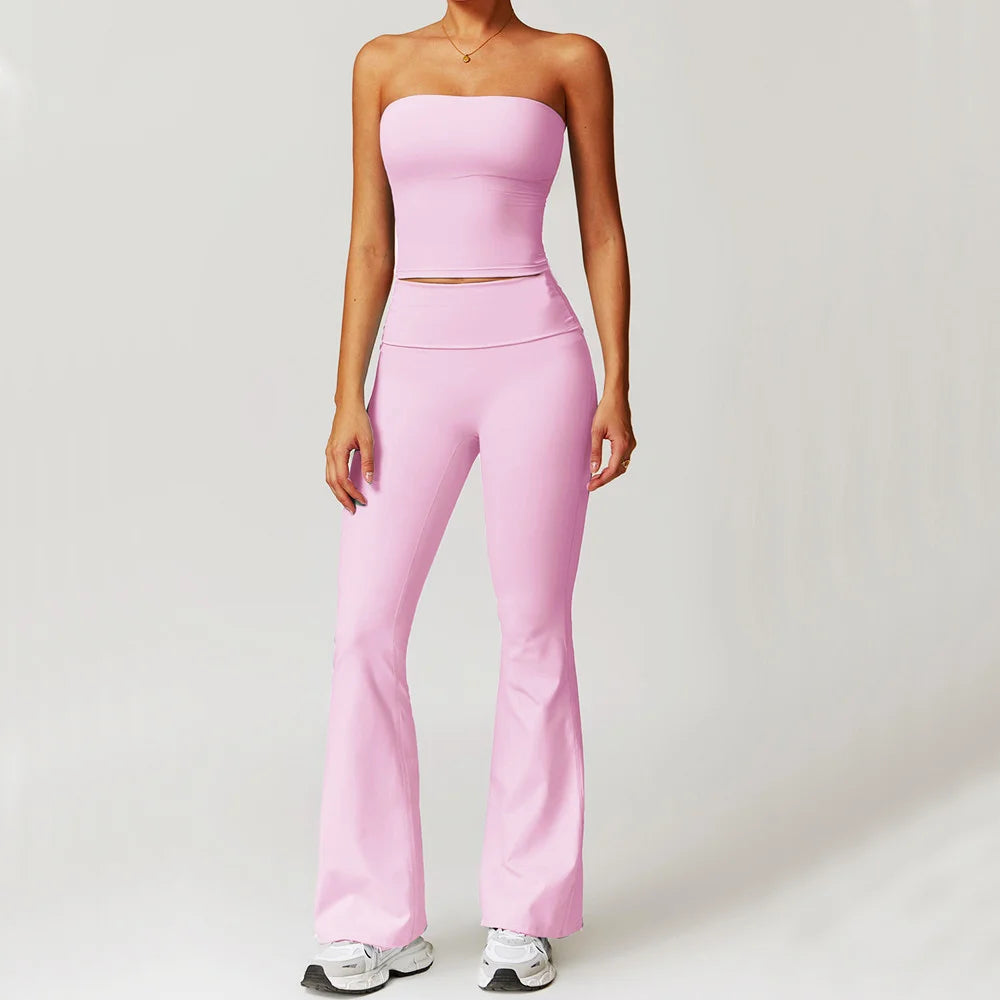 Person wearing a pink strapless top and leggings- front view