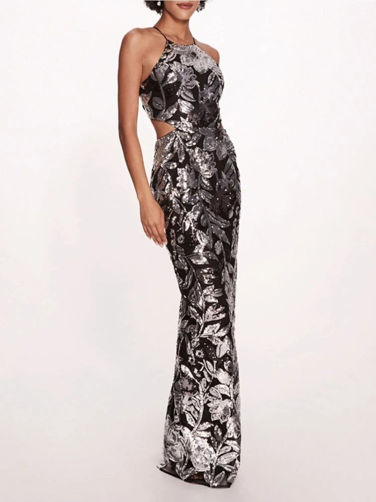Black floral patterned dress on a white background