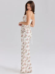 Woman wearing a floral dress on a gray background