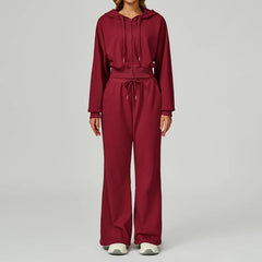A matching workout set in a rich burgundy color, styled for the gym.
