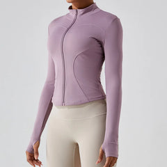 A close-up of a fitted running jacket, highlighting the thumbholes on the cuffs.
