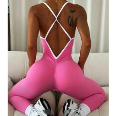 A woman wearing a sleek, seamless workout jumpsuit in a bright blue color.