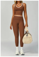 A matching sports bra and shorts set in a neutral brown color.